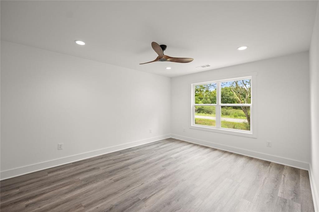 182 Hardman Road Clarkesville, GA 30523 - Photo 35 of 62 wooden floor in an empty room with a window