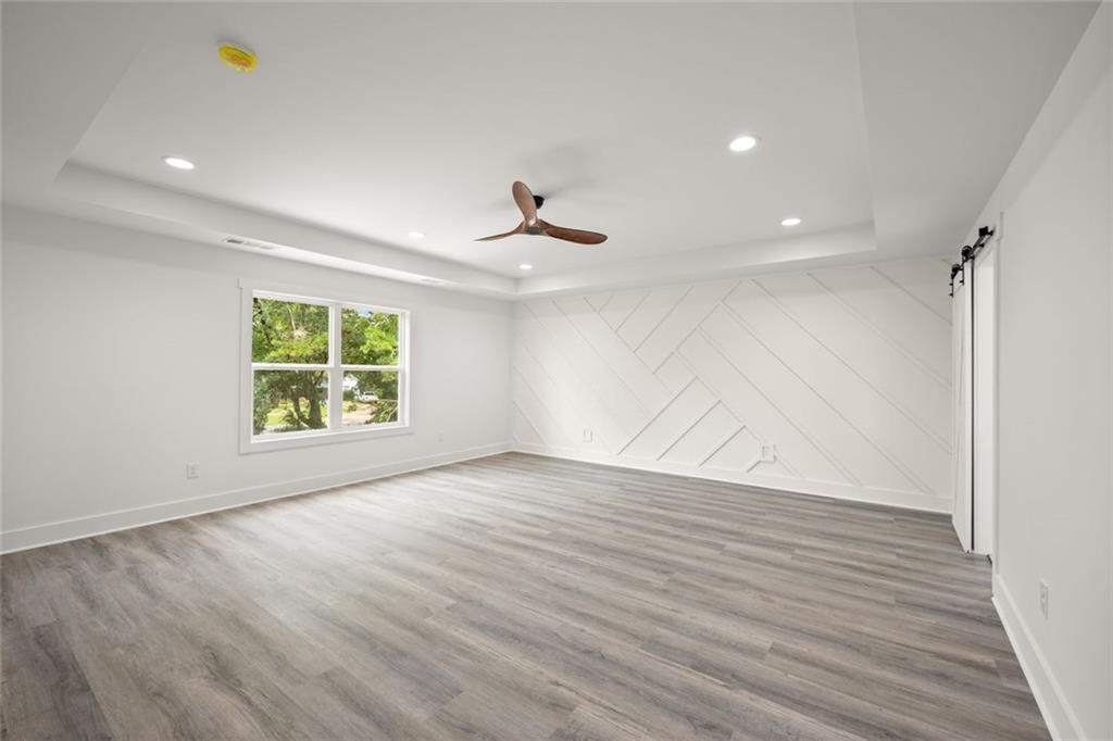 182 Hardman Road Clarkesville, GA 30523 - Photo 38 of 62 wooden floor in an empty room with a window