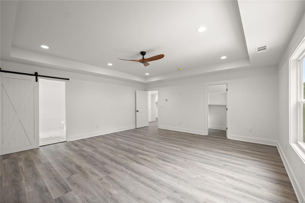 182 Hardman Road Clarkesville, GA 30523 - Photo 40 of 62 wooden floor in an empty room with a window