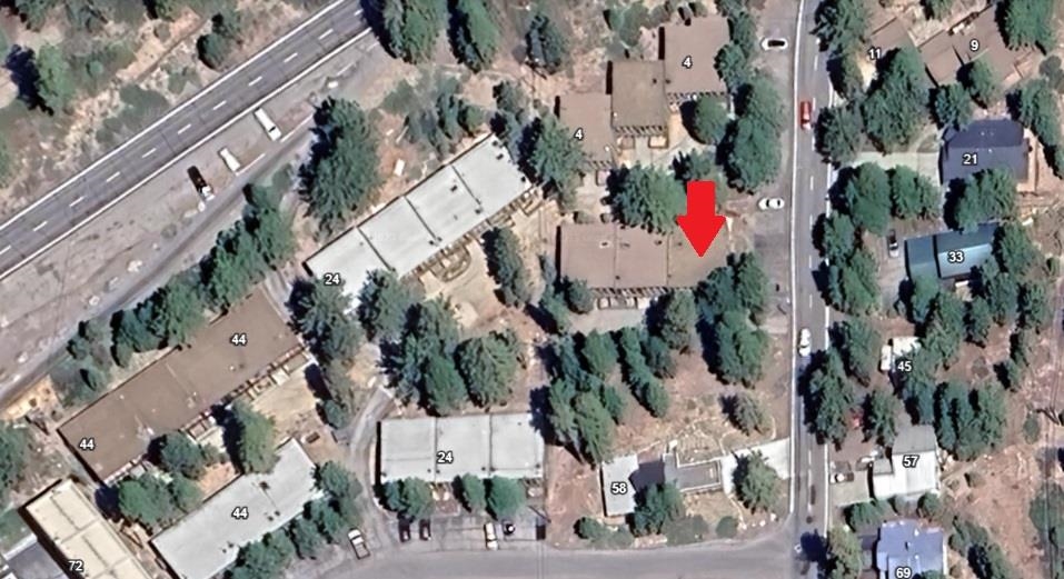 4 Kelley Road, Unit 1 Mammoth Lakes, CA 93546 - Photo 2 of 5 an aerial view of multi story residential apartment building and parking