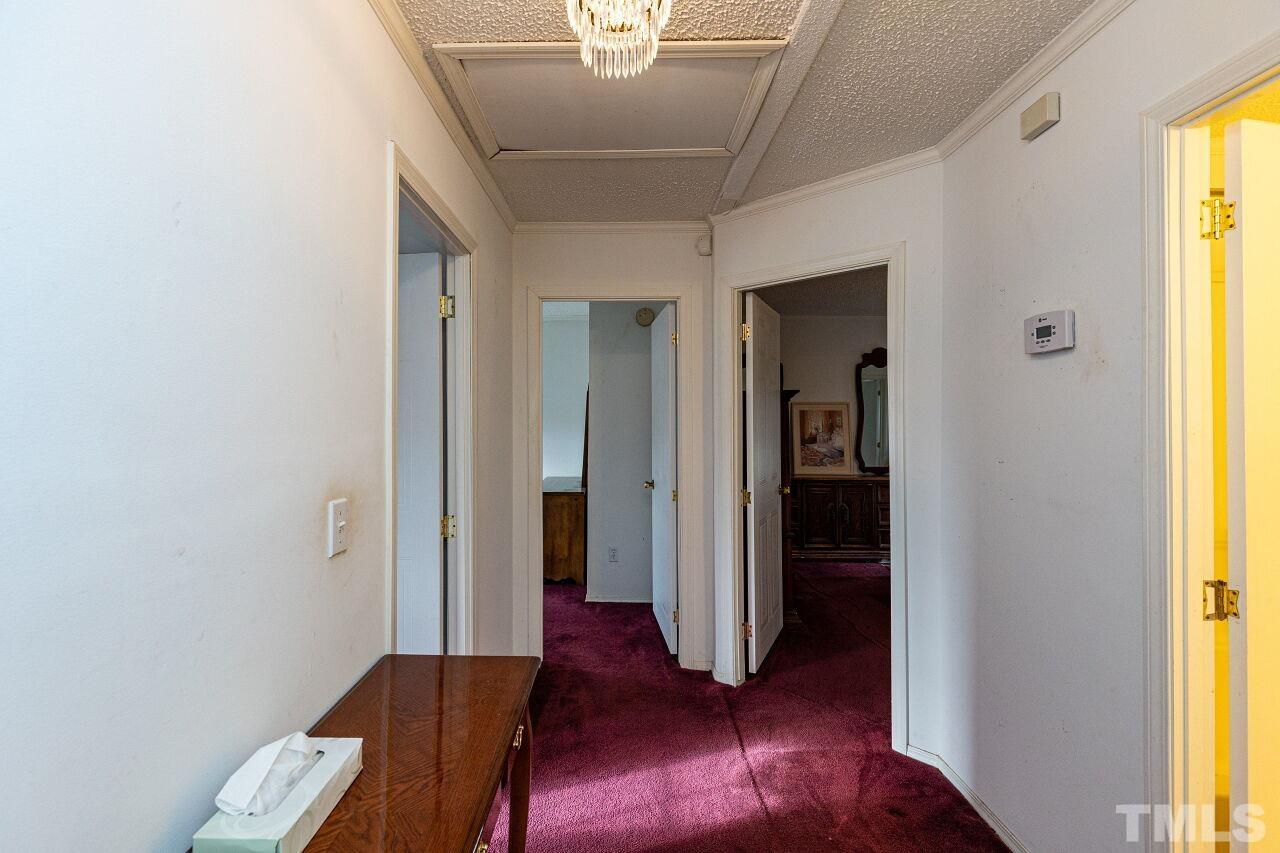 995 Genoa Road Dudley, NC 28333 - Photo 14 of 28 a view of a hallway with windows and wooden floor