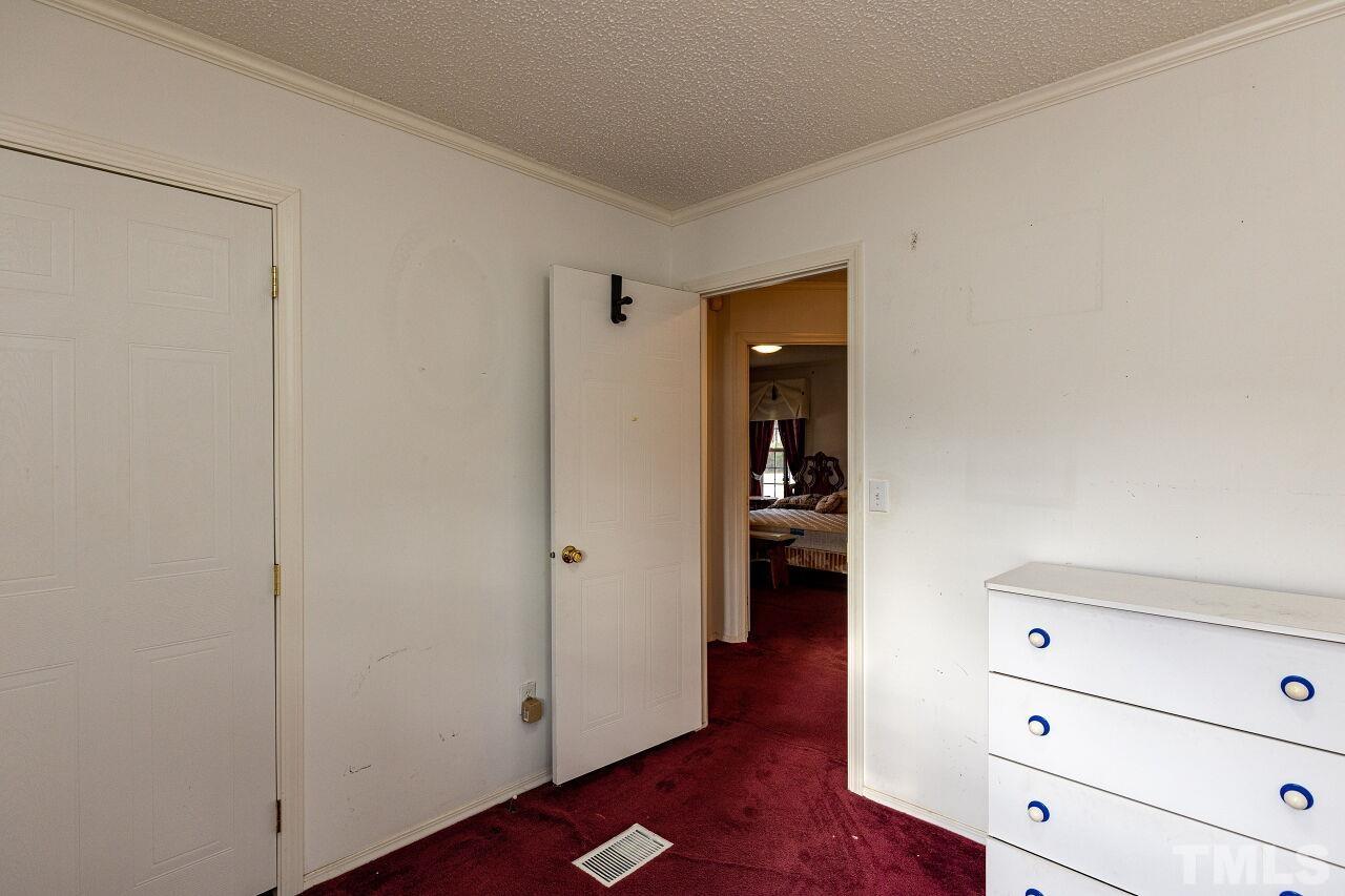 995 Genoa Road Dudley, NC 28333 - Photo 24 of 28 a view of a hallway with closet and wooden floor