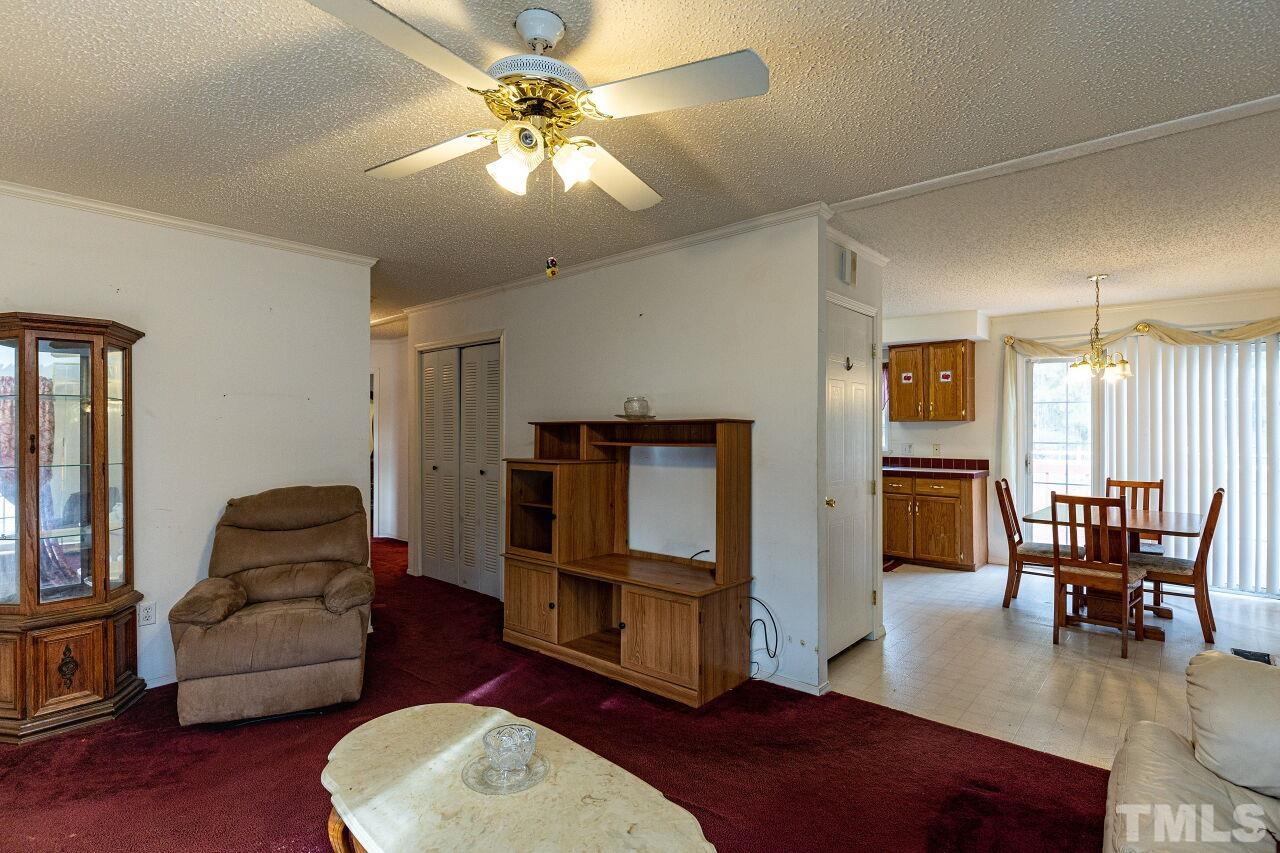 995 Genoa Road Dudley, NC 28333 - Photo 7 of 28 a living room with furniture and a flat screen tv