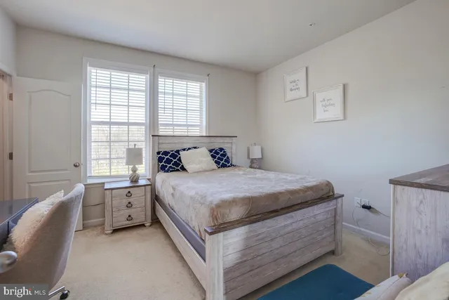 a spacious bedroom with a bed and a couch