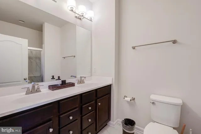 a bathroom with a glass shower door