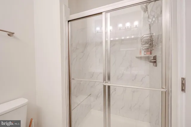 a view of a yard with iron fence