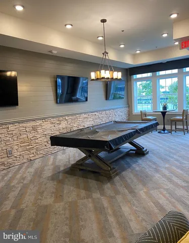 a front view of residential houses with yard and ocean view