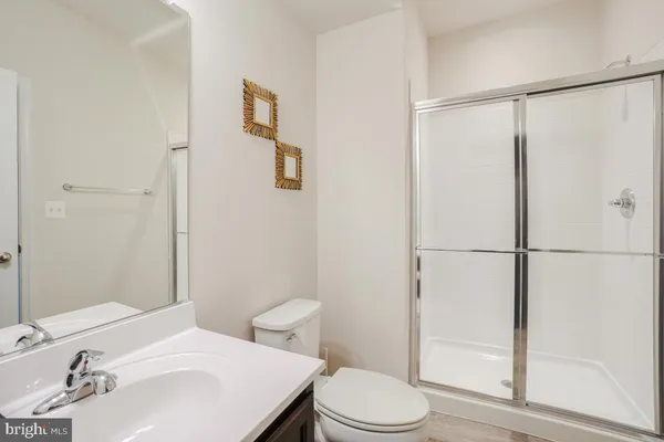 a large white kitchen with a large window