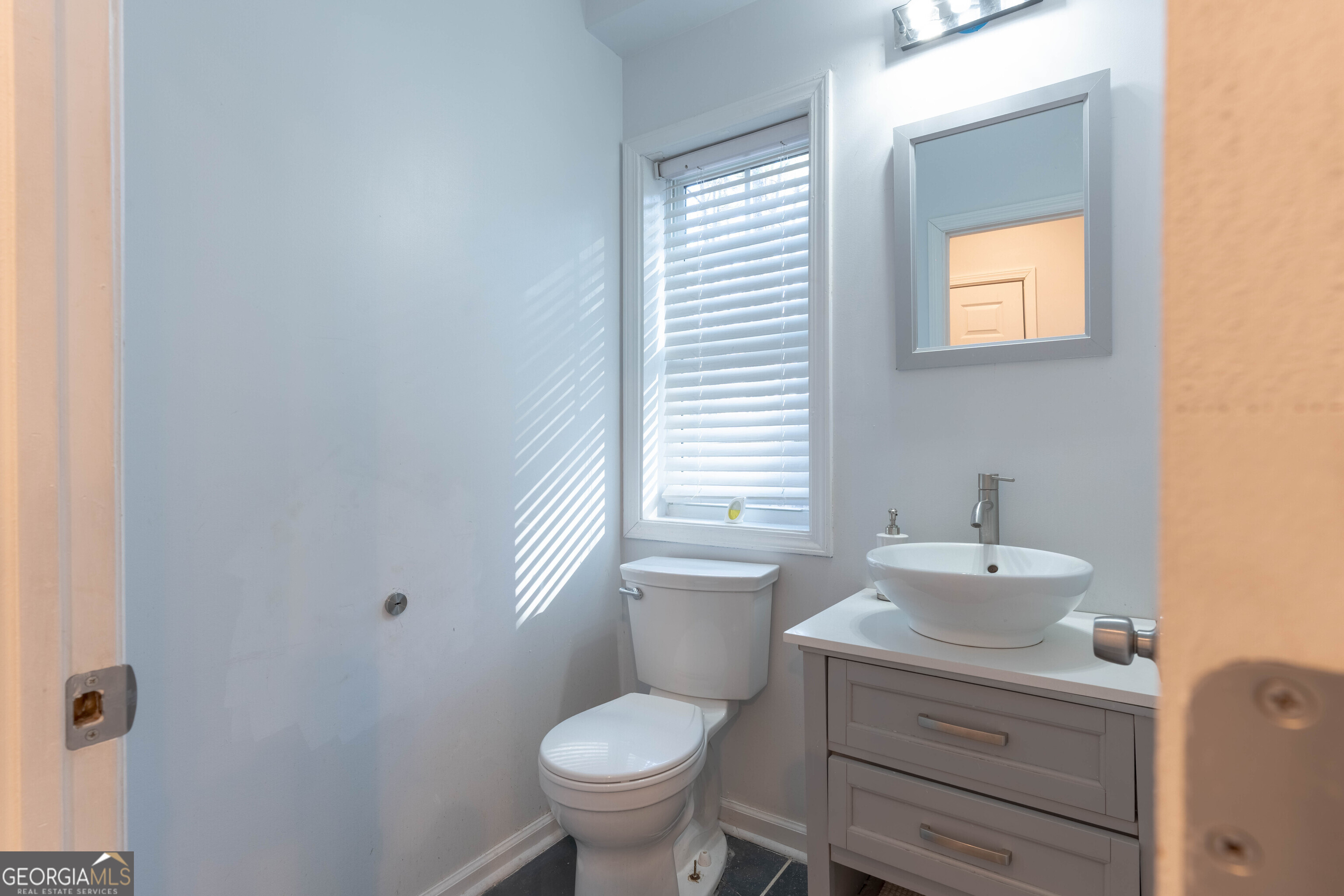 157 Watkins Road Flovilla, GA 30216 - Photo 13 of 31 a bathroom with a sink toilet and mirror