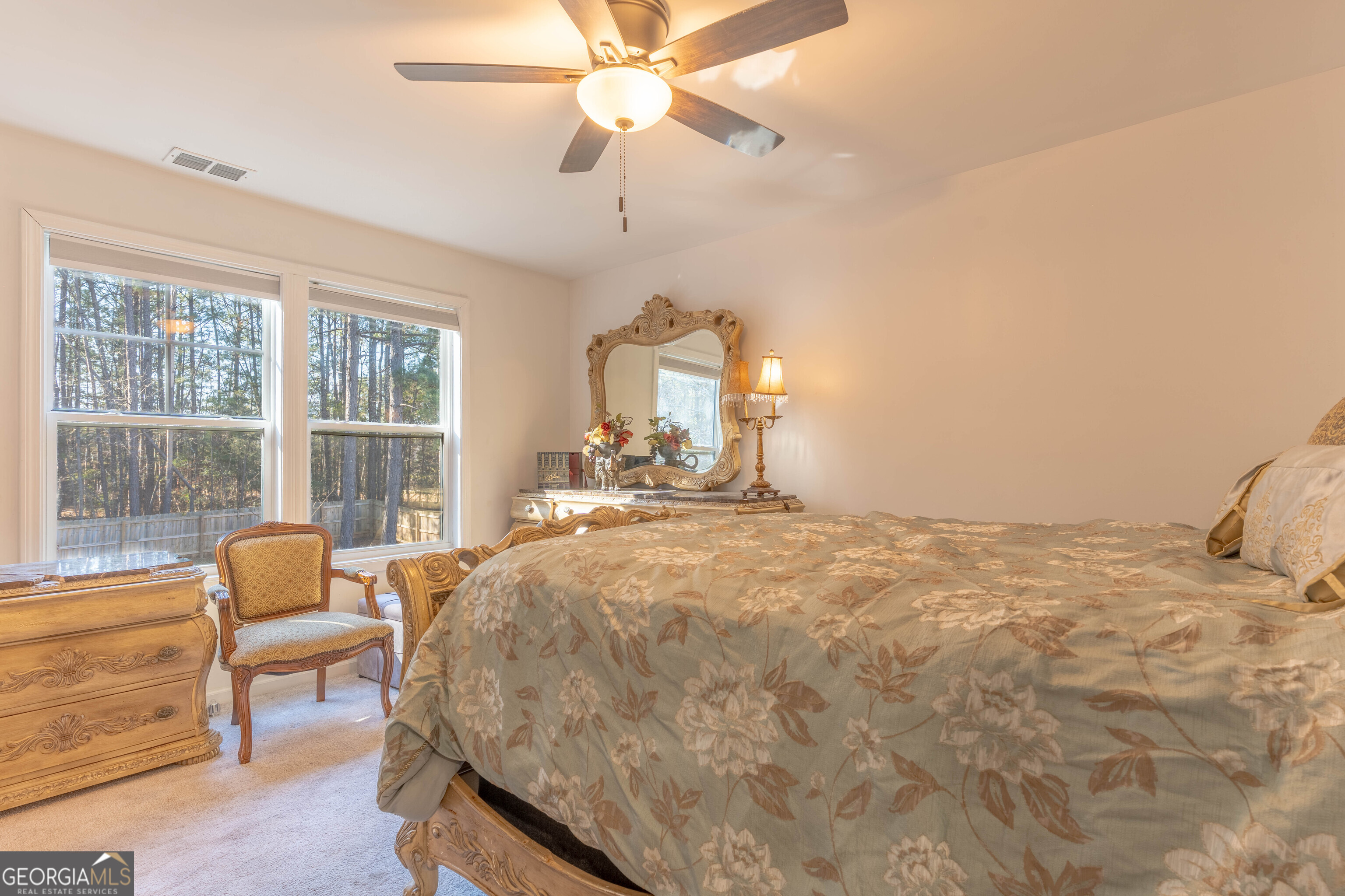 157 Watkins Road Flovilla, GA 30216 - Photo 16 of 31 a bed room with a bed and a chair