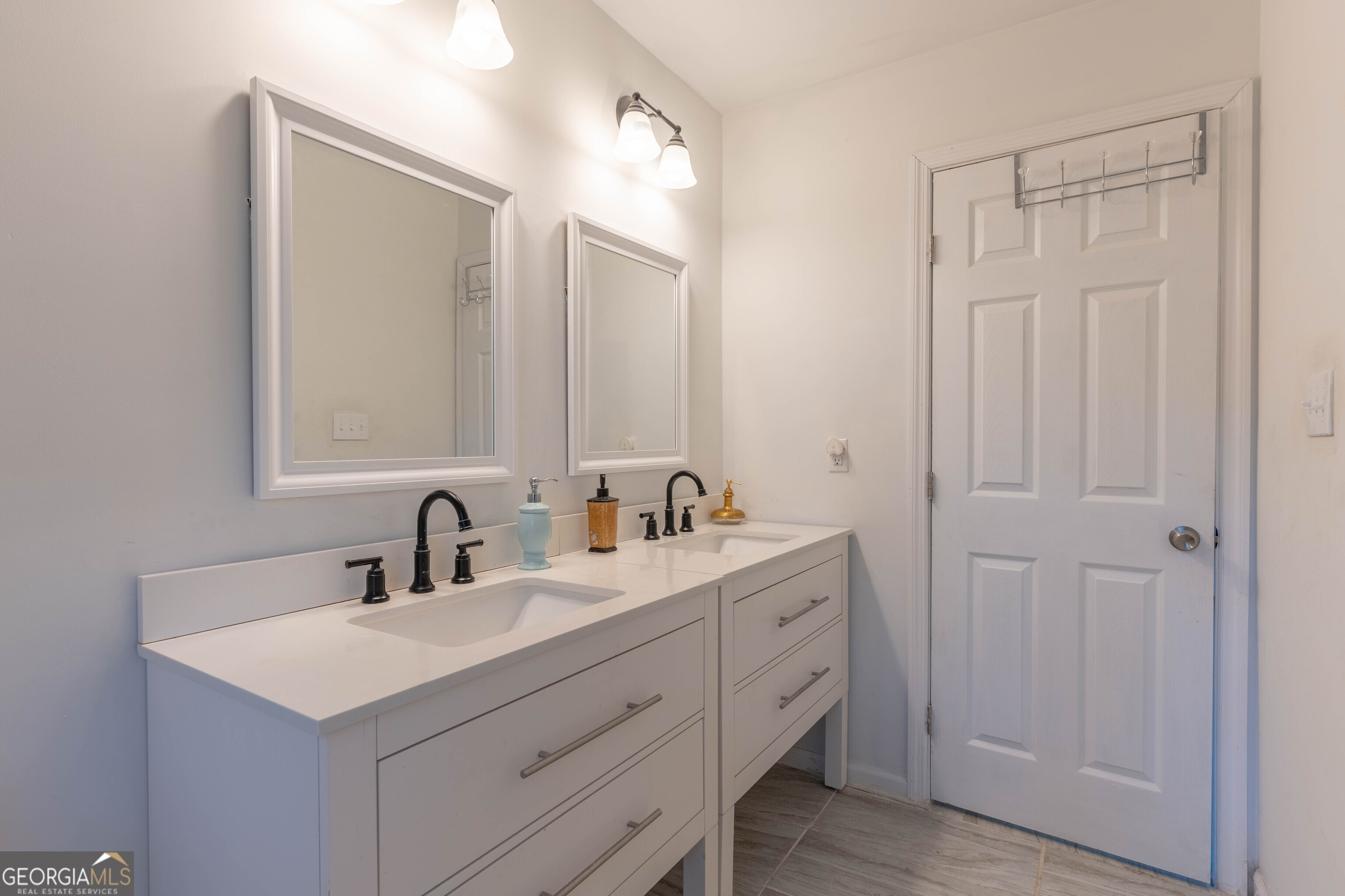 157 Watkins Road Flovilla, GA 30216 - Photo 18 of 31 a bathroom with a sink and a mirror