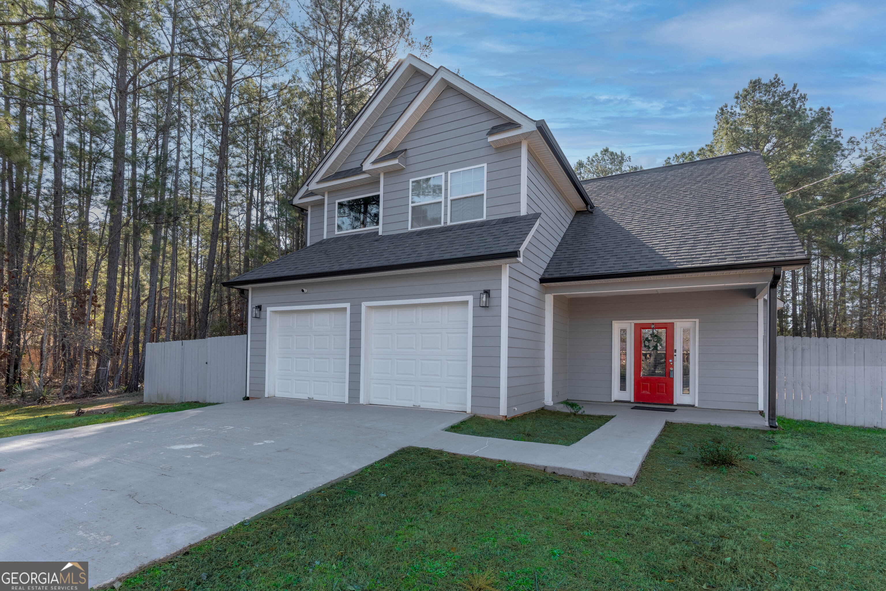 157 Watkins Road Flovilla, GA 30216 - Photo 2 of 31 a front view of a house with a yard and garage