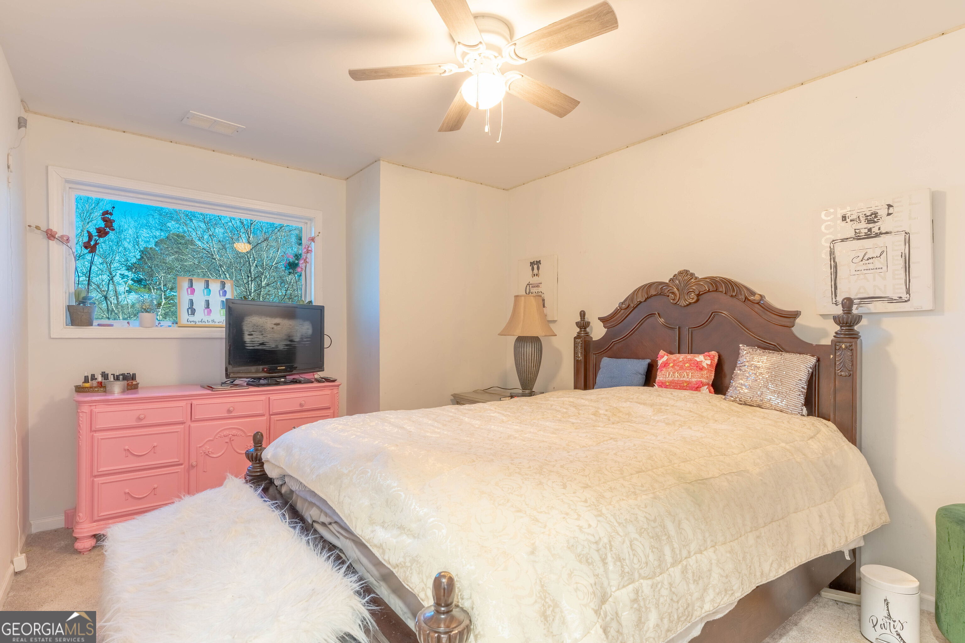 157 Watkins Road Flovilla, GA 30216 - Photo 21 of 31 a bedroom with a bed and a chandelier fan