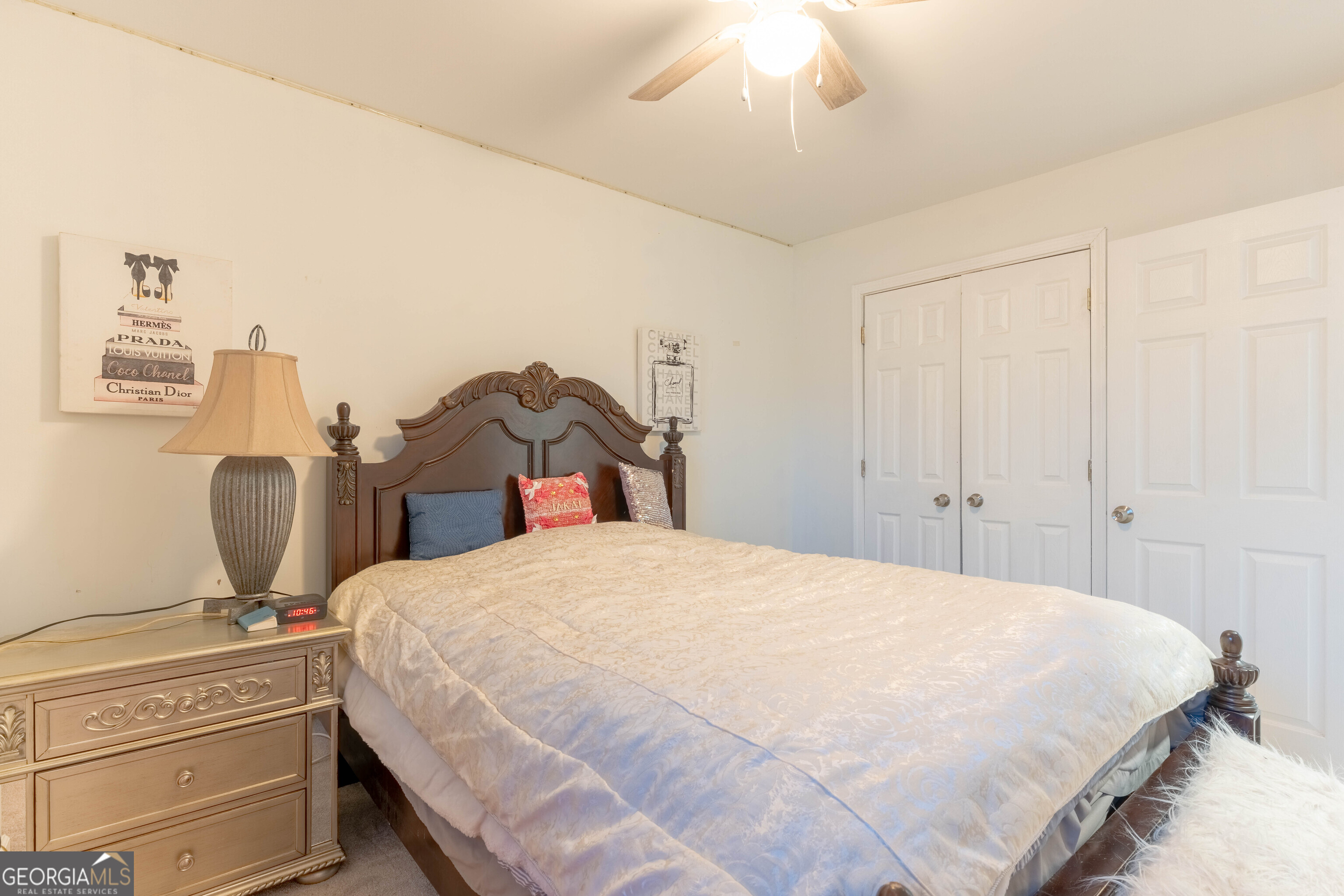 157 Watkins Road Flovilla, GA 30216 - Photo 22 of 31 a bedroom with a bed and a chandelier