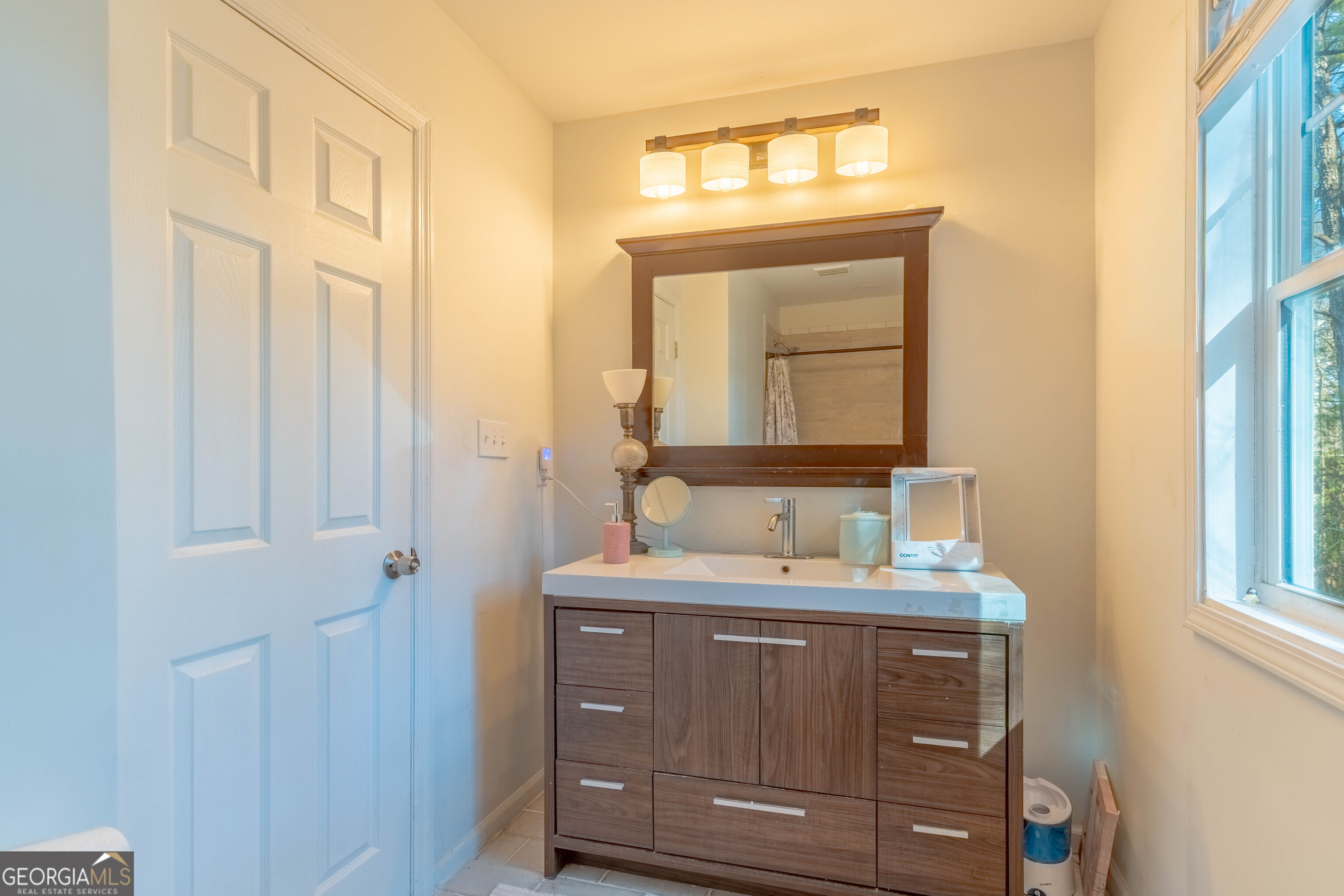 157 Watkins Road Flovilla, GA 30216 - Photo 25 of 31 a bathroom with a sink vanity and a mirror