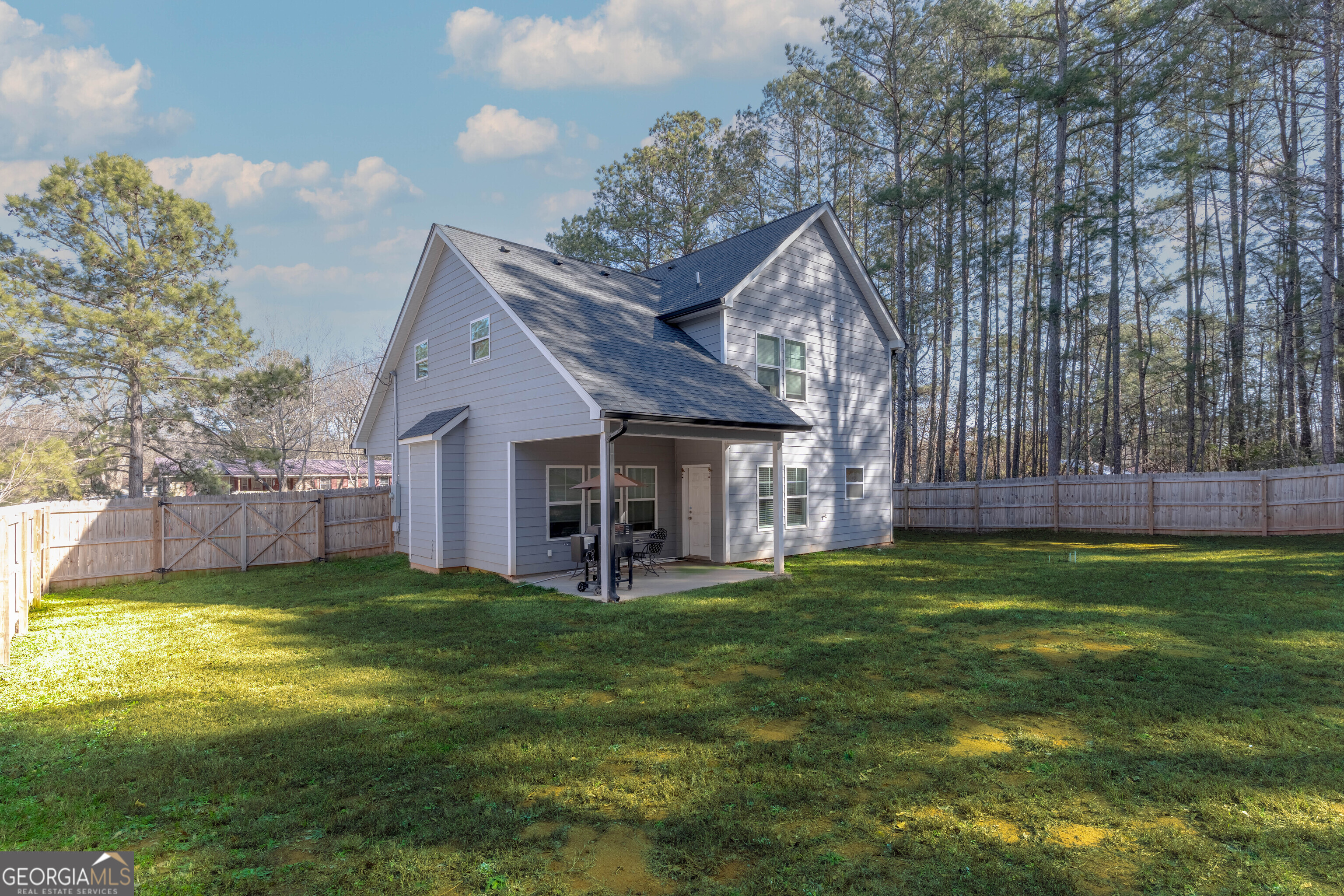 157 Watkins Road Flovilla, GA 30216 - Photo 28 of 31 a view of a house with a yard and sitting area