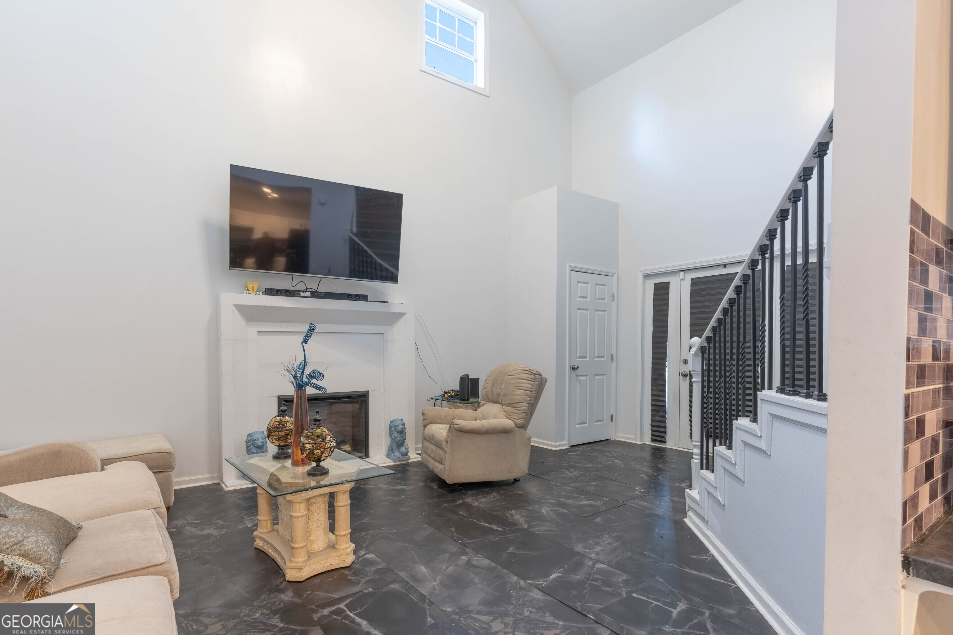 157 Watkins Road Flovilla, GA 30216 - Photo 4 of 31 a living room with furniture and a flat screen tv