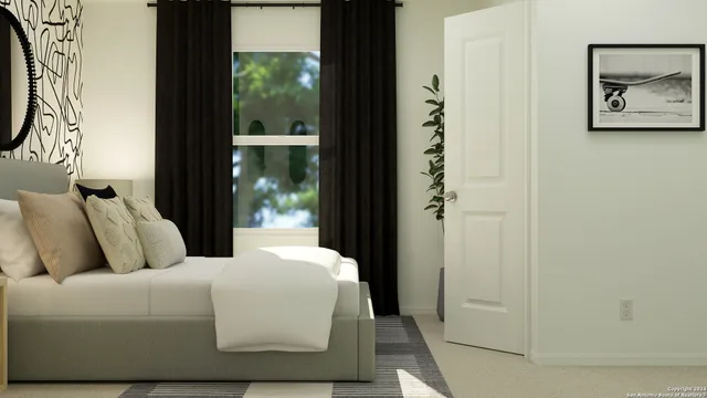 a bedroom with bed and window