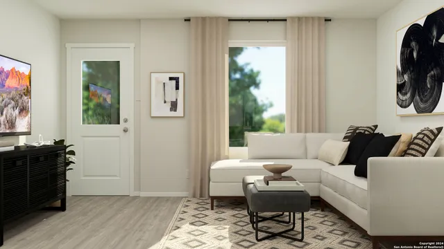 a living room with furniture and a window