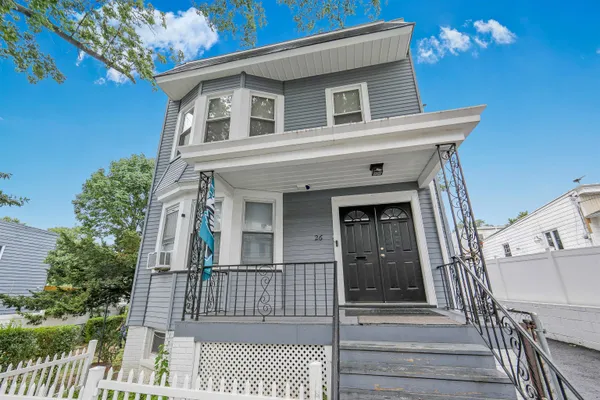 a front view of a house with a porch