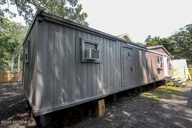 a wooden fence with a small yard