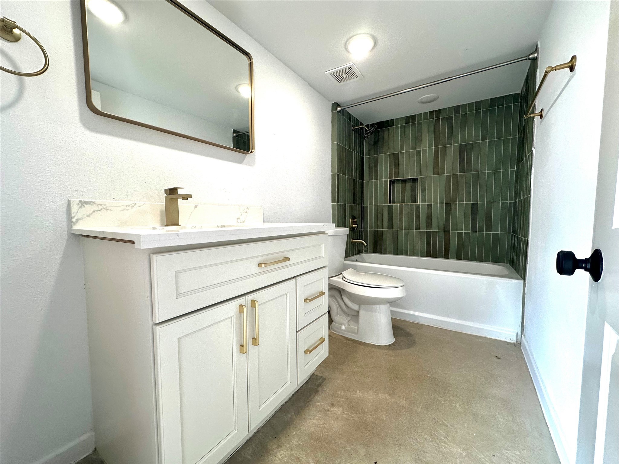 808 Oakhurst Street, Unit 3 Houston, TX 77023 - Photo 3 of 10 a bathroom with a sink a toilet and a mirror