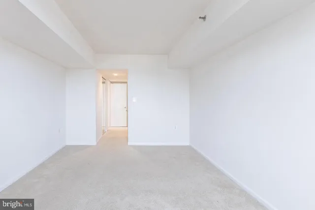 a white toilet sitting next to a shower curtain