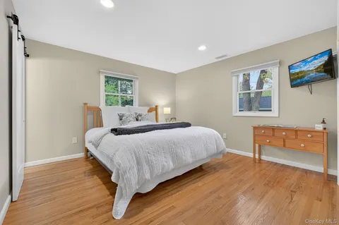 a bed room with a bed and a window