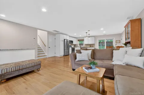a living room with furniture and a table