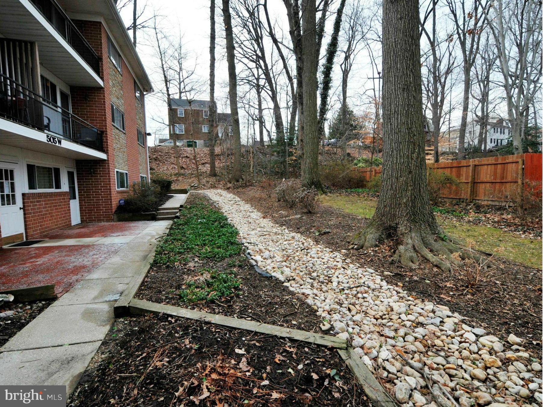 505 Epsom Road, Unit TA Towson, MD 21286 - Photo 10 of 11 a view of a yard with plants and trees