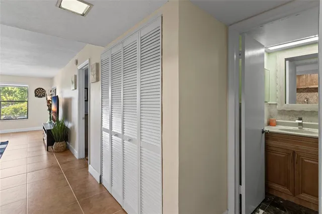 a kitchen with granite countertop a refrigerator stove and microwave
