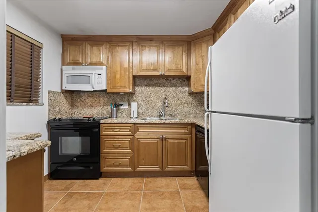 a view of kitchen and utility room