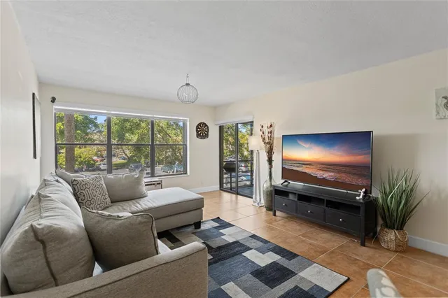 a living room with furniture and windows