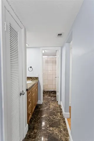 a view of an empty room with shelves