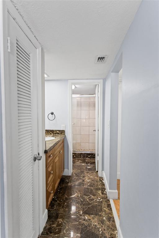 2312 South Cypress Bend Drive, Unit 205 Pompano Beach, FL 33069 - Photo 36 of 61 a bathroom with a sink and a mirror