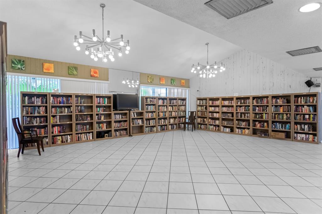 2312 South Cypress Bend Drive, Unit 205 Pompano Beach, FL 33069 - Photo 44 of 61 a view of an empty room with shelves