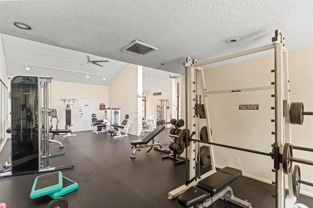 2312 South Cypress Bend Drive, Unit 205 Pompano Beach, FL 33069 - Photo 49 of 61 a view of a room with gym equipment