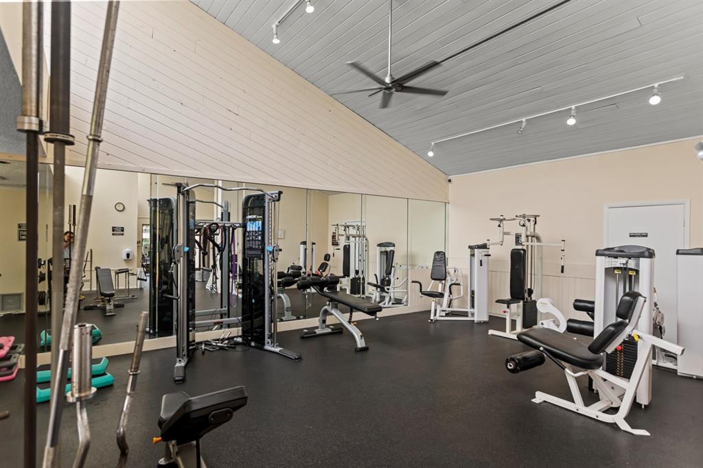 2312 South Cypress Bend Drive, Unit 205 Pompano Beach, FL 33069 - Photo 50 of 61 a view of a room with gym equipment