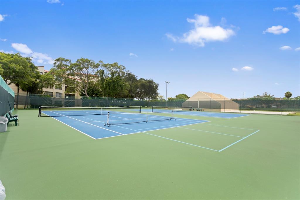 2312 South Cypress Bend Drive, Unit 205 Pompano Beach, FL 33069 - Photo 57 of 61 a view of a tennis court