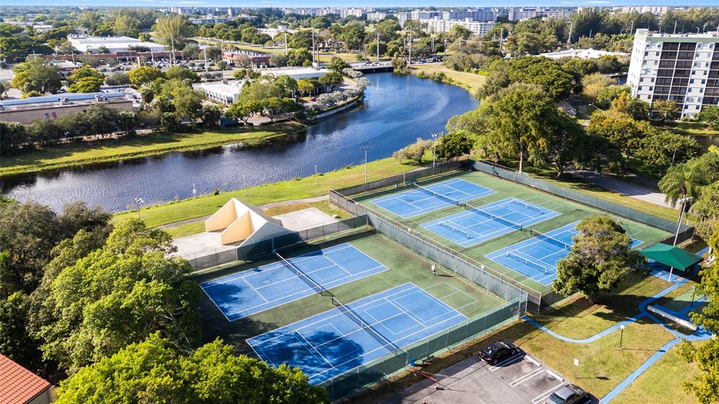 2312 South Cypress Bend Drive, Unit 205 Pompano Beach, FL 33069 - Photo 59 of 61 an aerial view of residential houses with outdoor space
