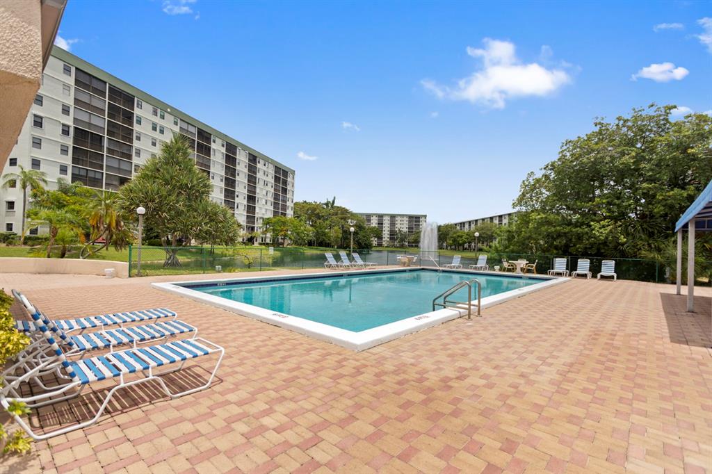 2312 South Cypress Bend Drive, Unit 205 Pompano Beach, FL 33069 - Photo 6 of 61 a view of swimming pool and outdoor space
