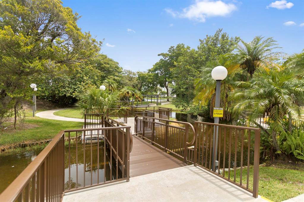 2312 South Cypress Bend Drive, Unit 205 Pompano Beach, FL 33069 - Photo 7 of 61 a view of a balcony with chairs