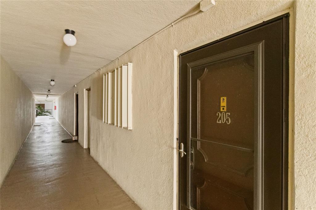 2312 South Cypress Bend Drive, Unit 205 Pompano Beach, FL 33069 - Photo 9 of 61 a view of hallway
