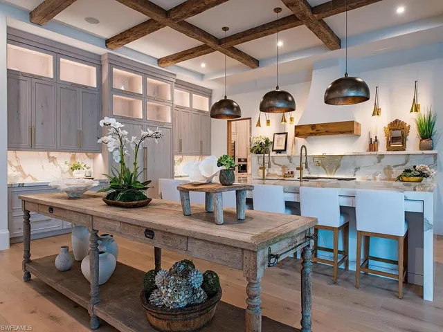 a kitchen with a table and chairs in it