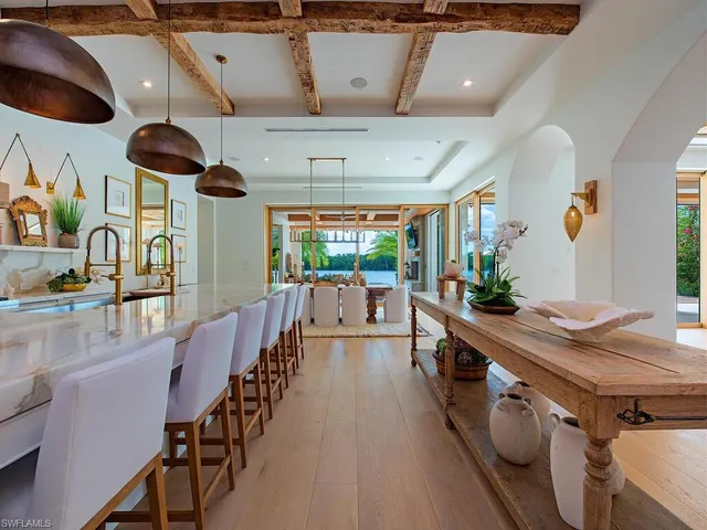 a kitchen with stainless steel appliances lots of counter space and wooden floors
