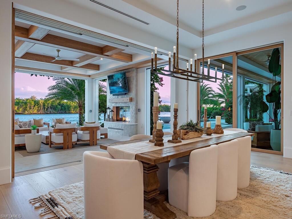 860 Admiralty Parade Naples, FL 34102 - Photo 19 of 45 a view of a dining room with furniture window and outside view