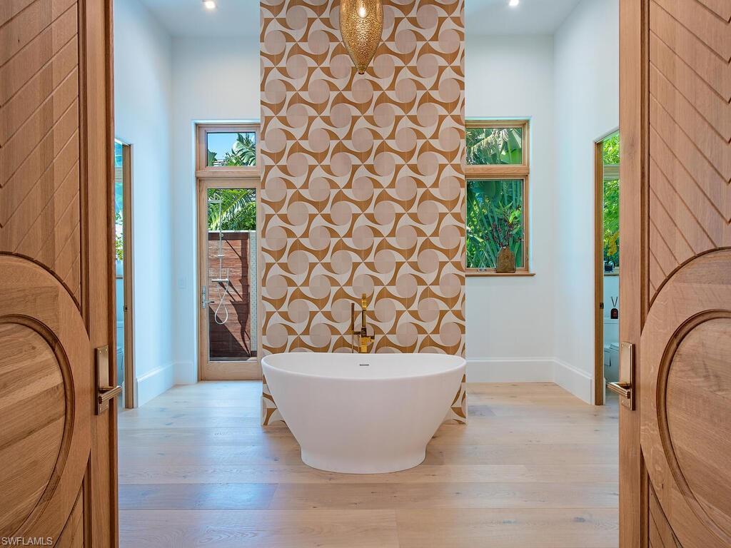 860 Admiralty Parade Naples, FL 34102 - Photo 31 of 45 a view of a potted plant in a corridor