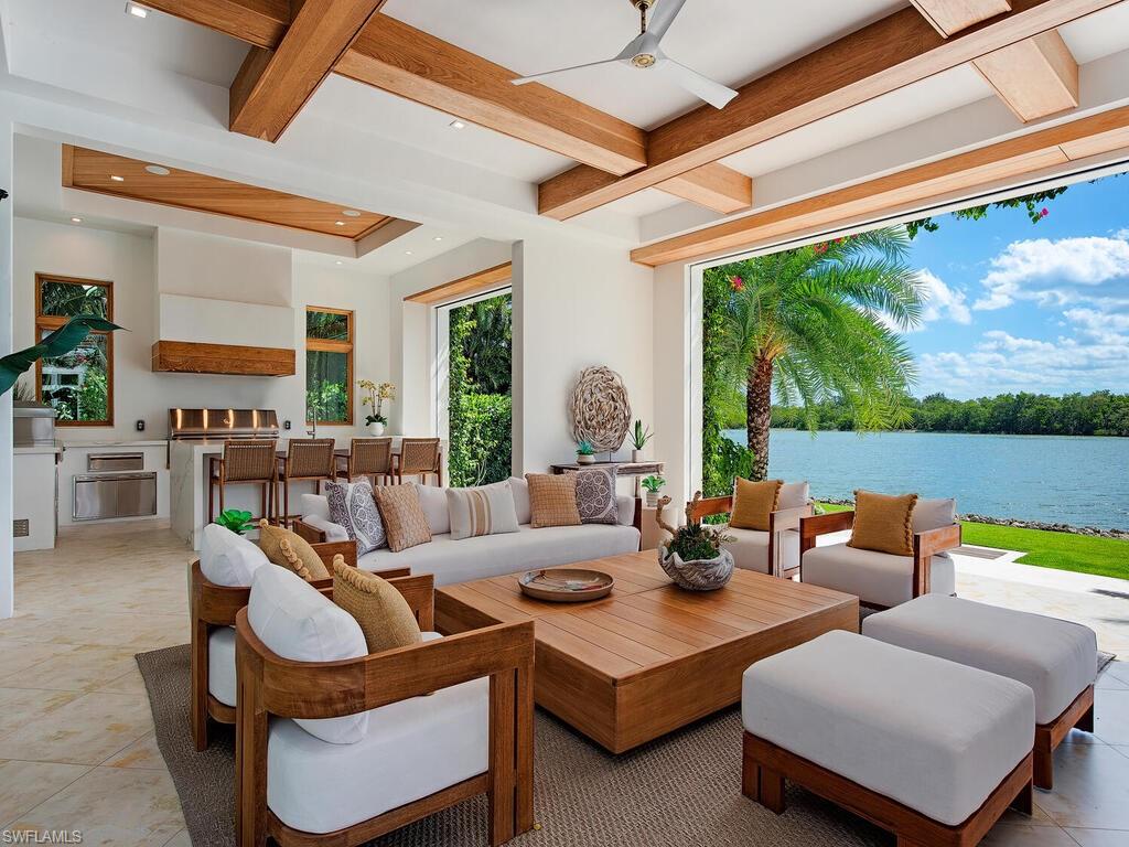 860 Admiralty Parade Naples, FL 34102 - Photo 38 of 45 a living room with furniture and a large window
