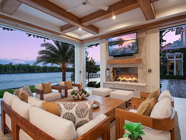 a view of a lake with couches and city view