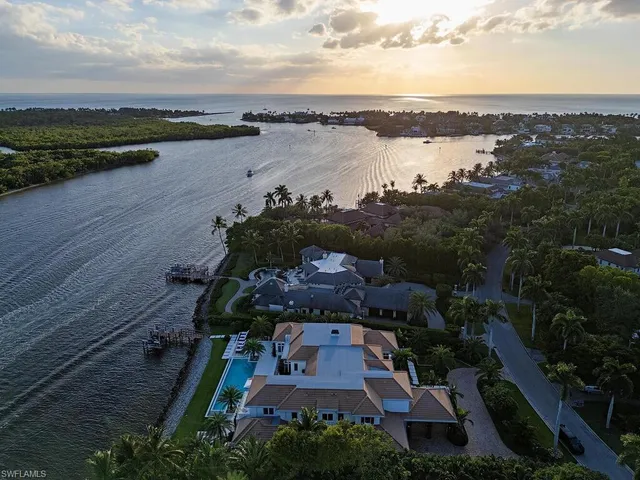 an aerial view of a house with a lake view